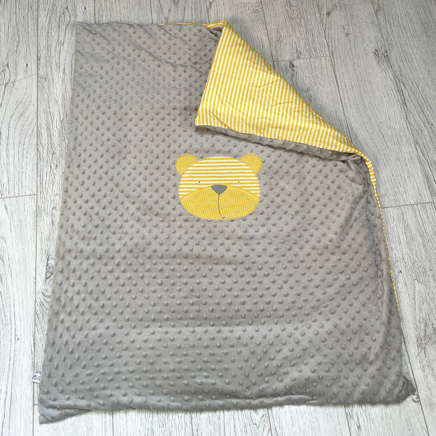 Trapuntino minky grigio con orso giallo